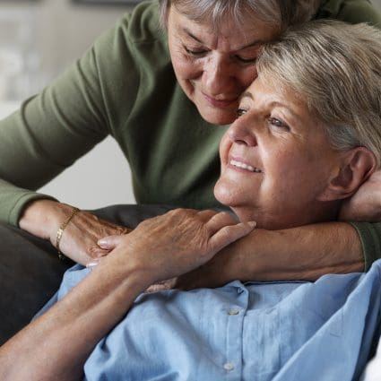 Happy queer eldery couple side view