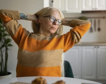Albino woman home doing chores